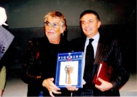 Nella foto con lo stilista Roberto Cavalli.